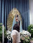 Lampedusa, woman paying Mary